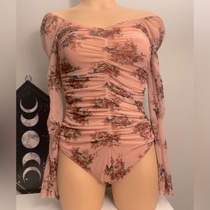 Pink with floral patter body suit by Rue21 size M